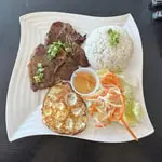 Grilled Pork Chop with Egg Over Rice at Dope pho