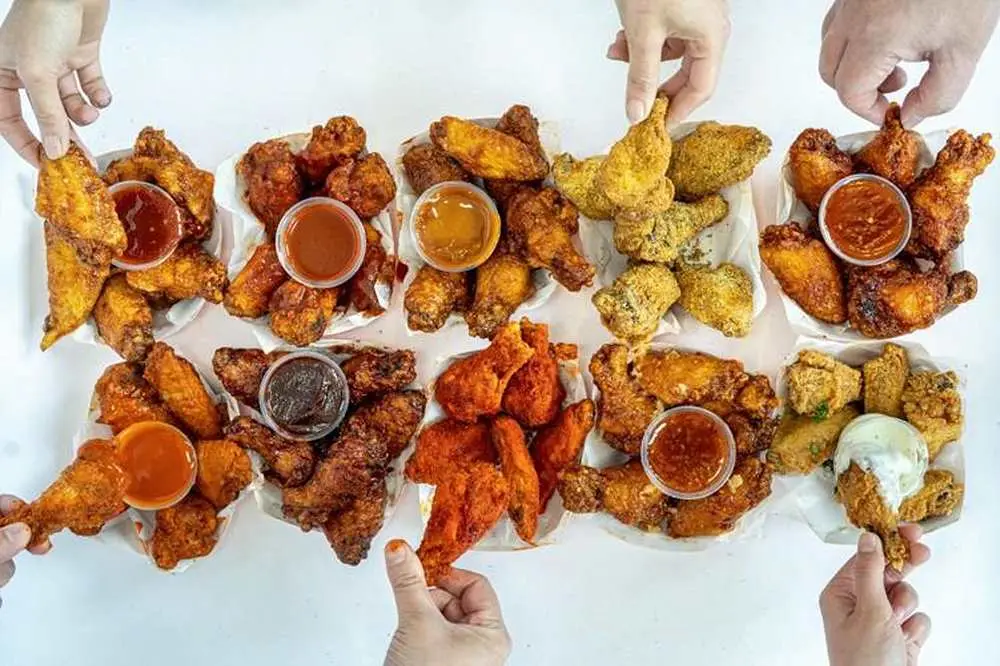 24 Wings Family Box (3 Sauces + 4 Sides) at iniWings