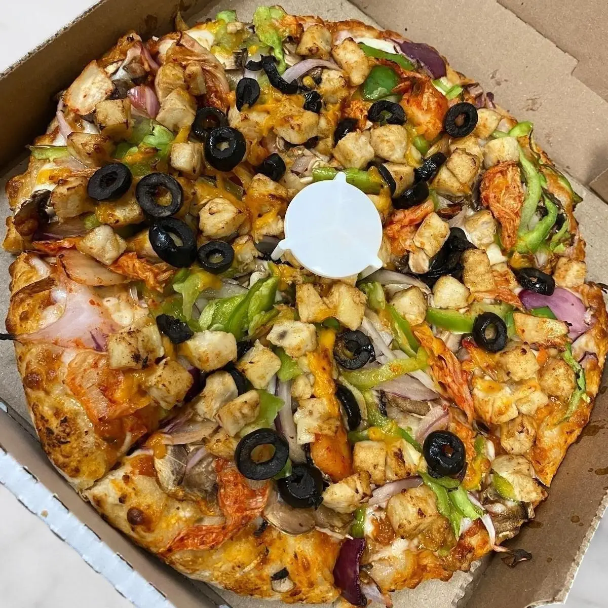 Smoky Kimchi BBQ chicken Pizza at Roll N Crust
