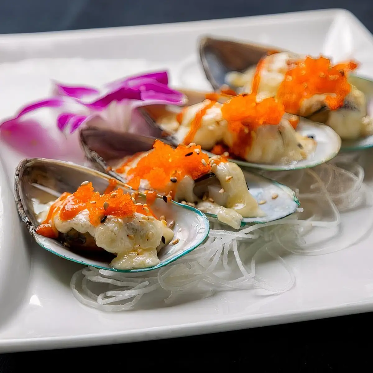 Baked Mussels (4pc) at Toro Sushi Stone Grill & Bar